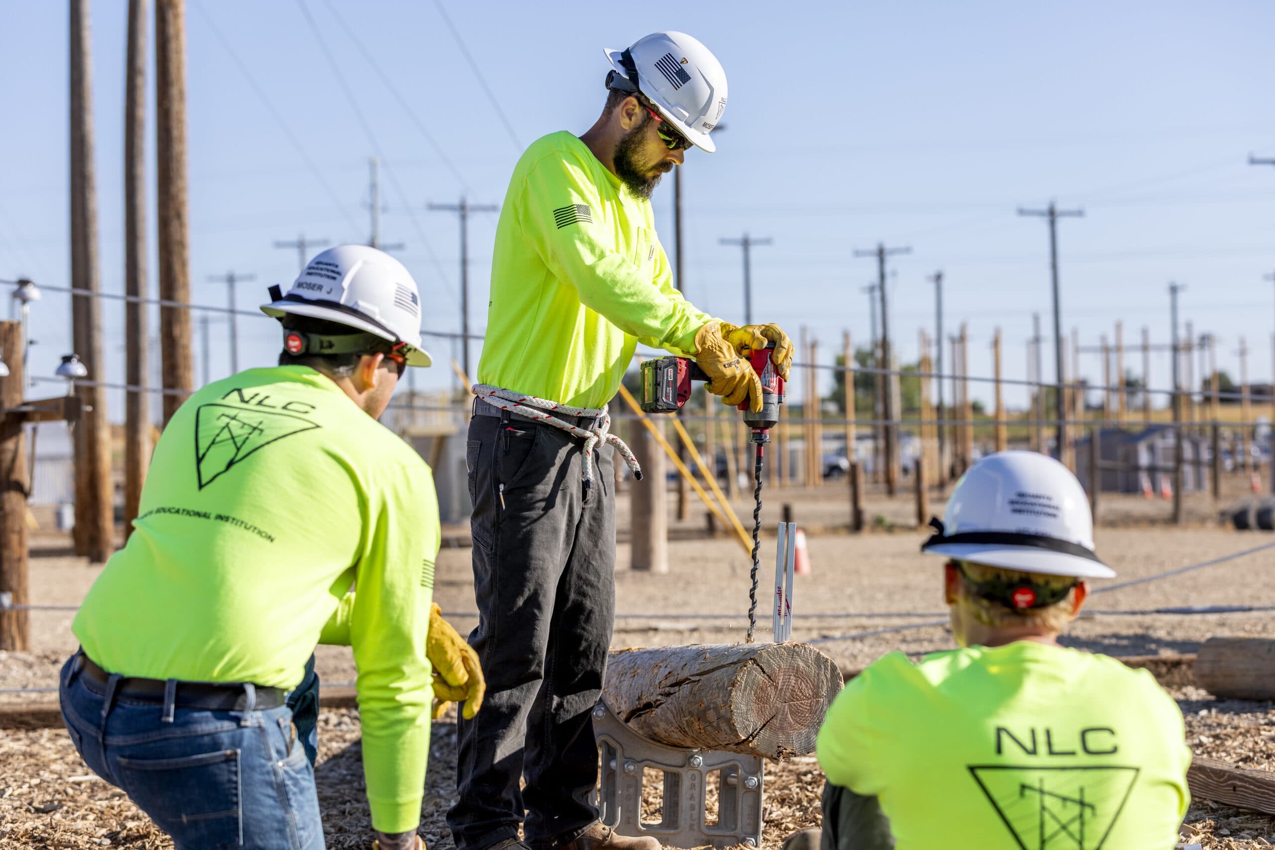 Group of lineman prepping to raise a new power pole | Northwest Lineman College