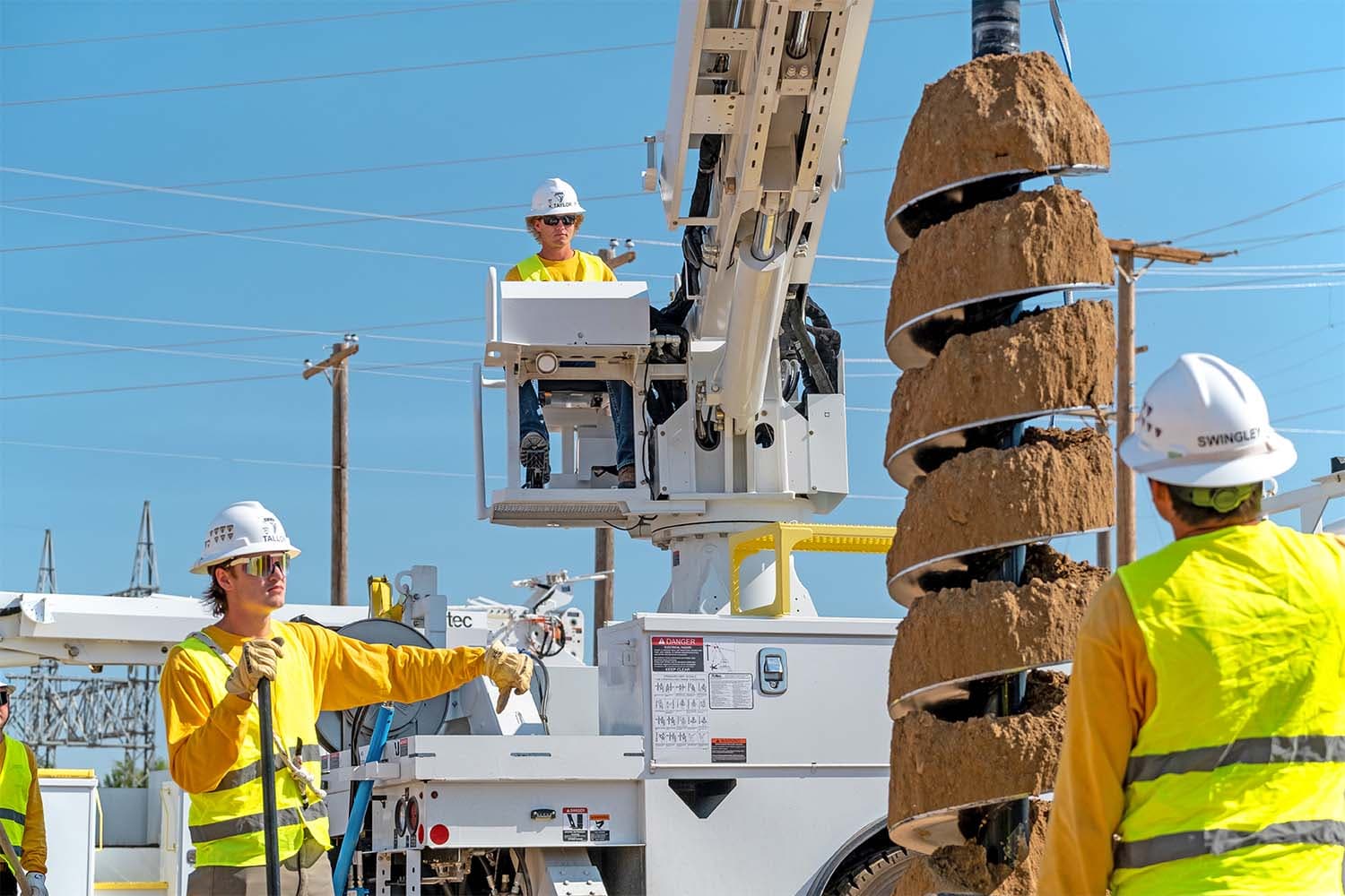 NLC students working on digger derrick truck